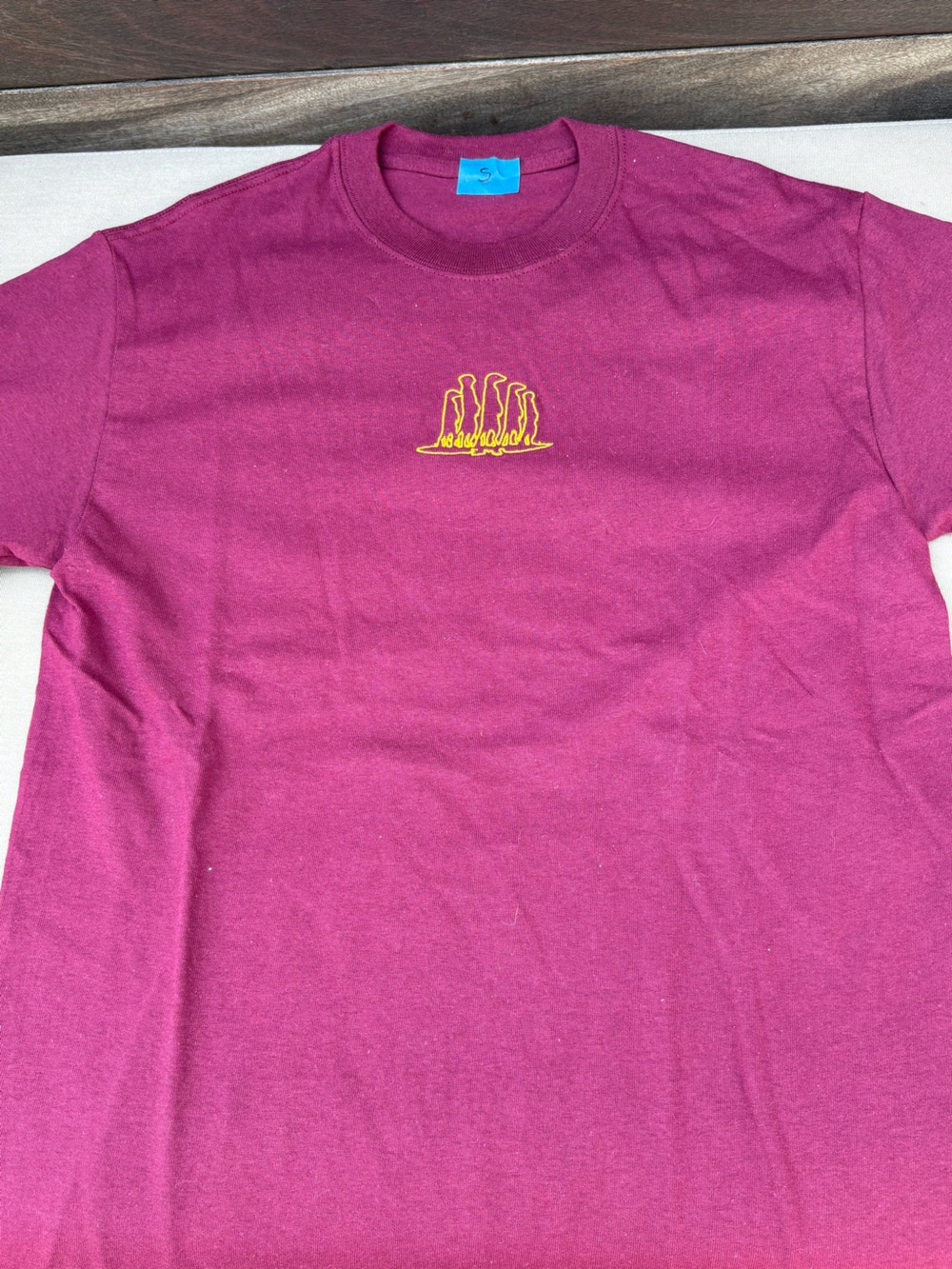 Magenta Tee with Small Yellow Embroidered Graphic